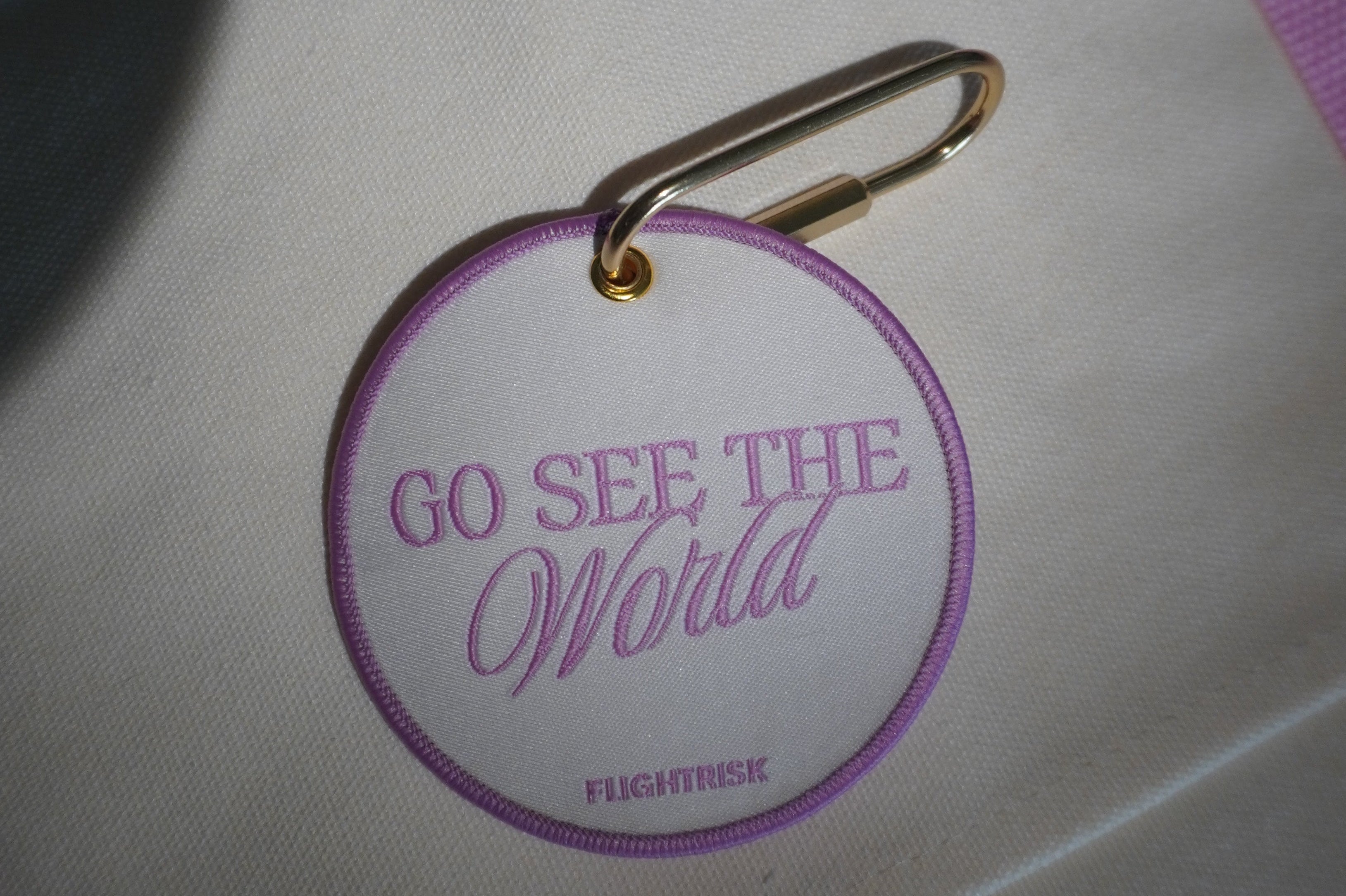 Pink go see the world tag